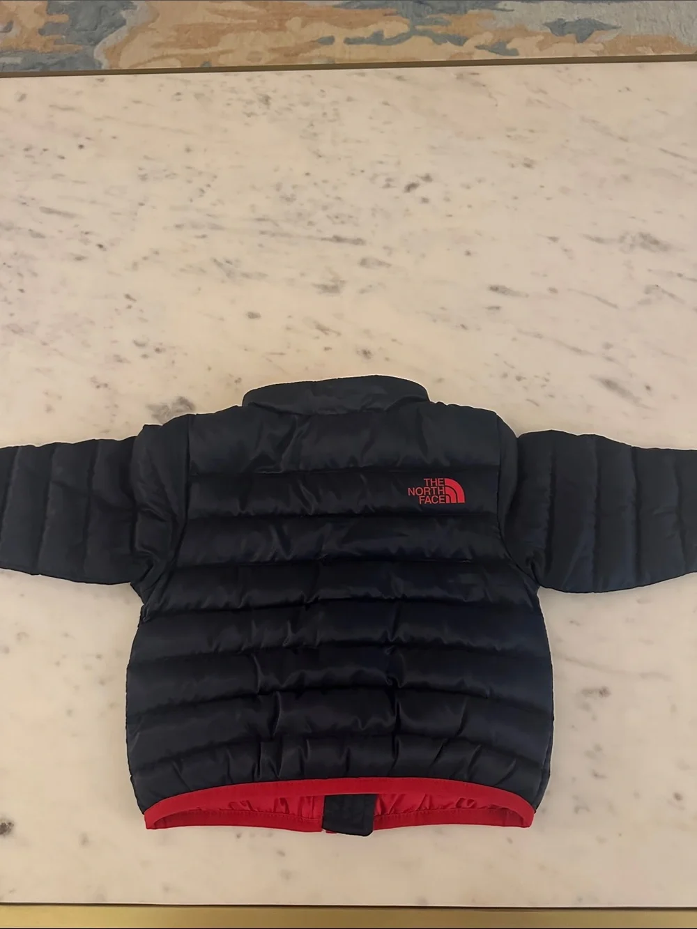 The North Face Navy Puffer Jacket with Red Accents